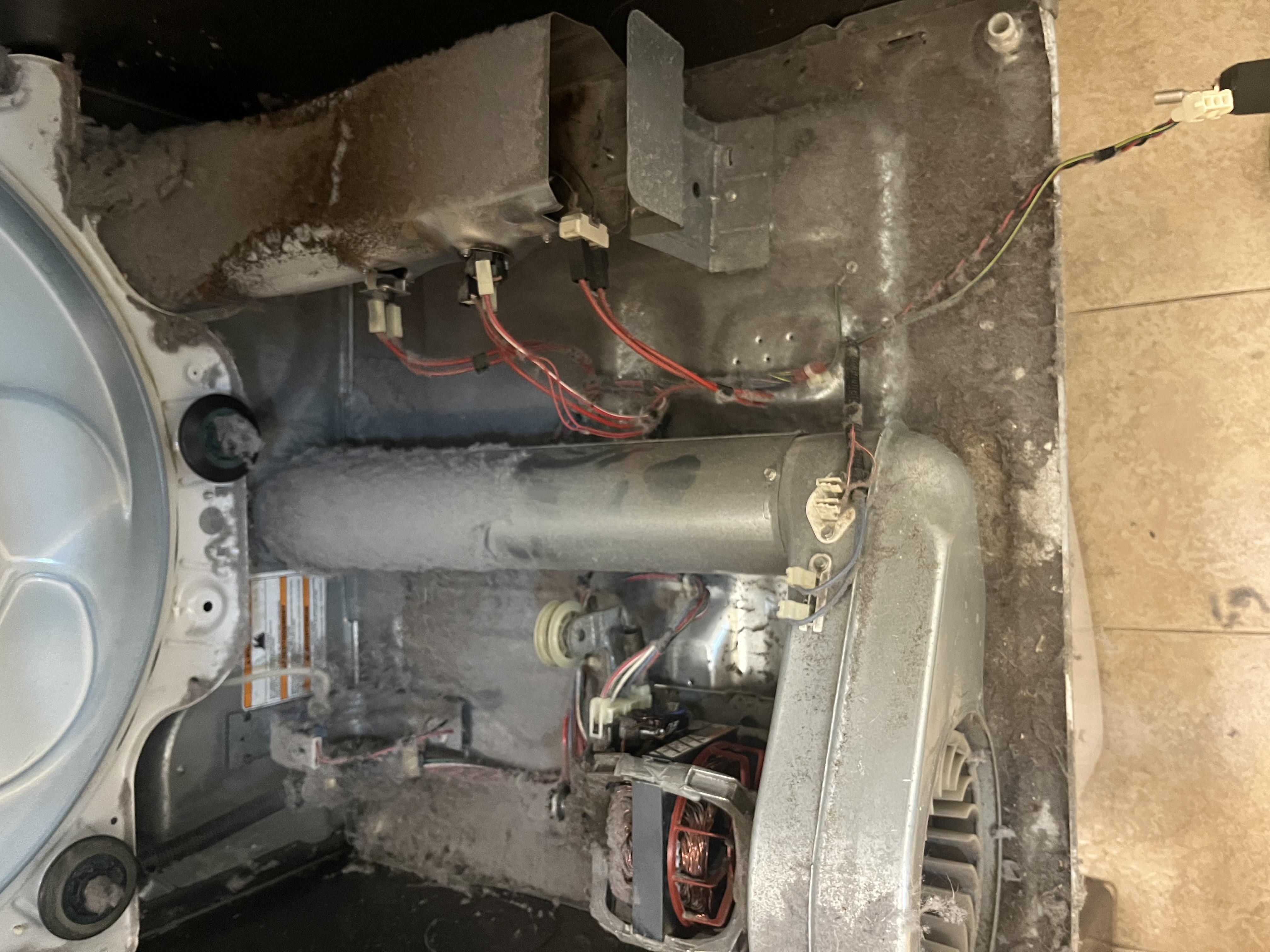 Dryer cabinet opened for repair inspection